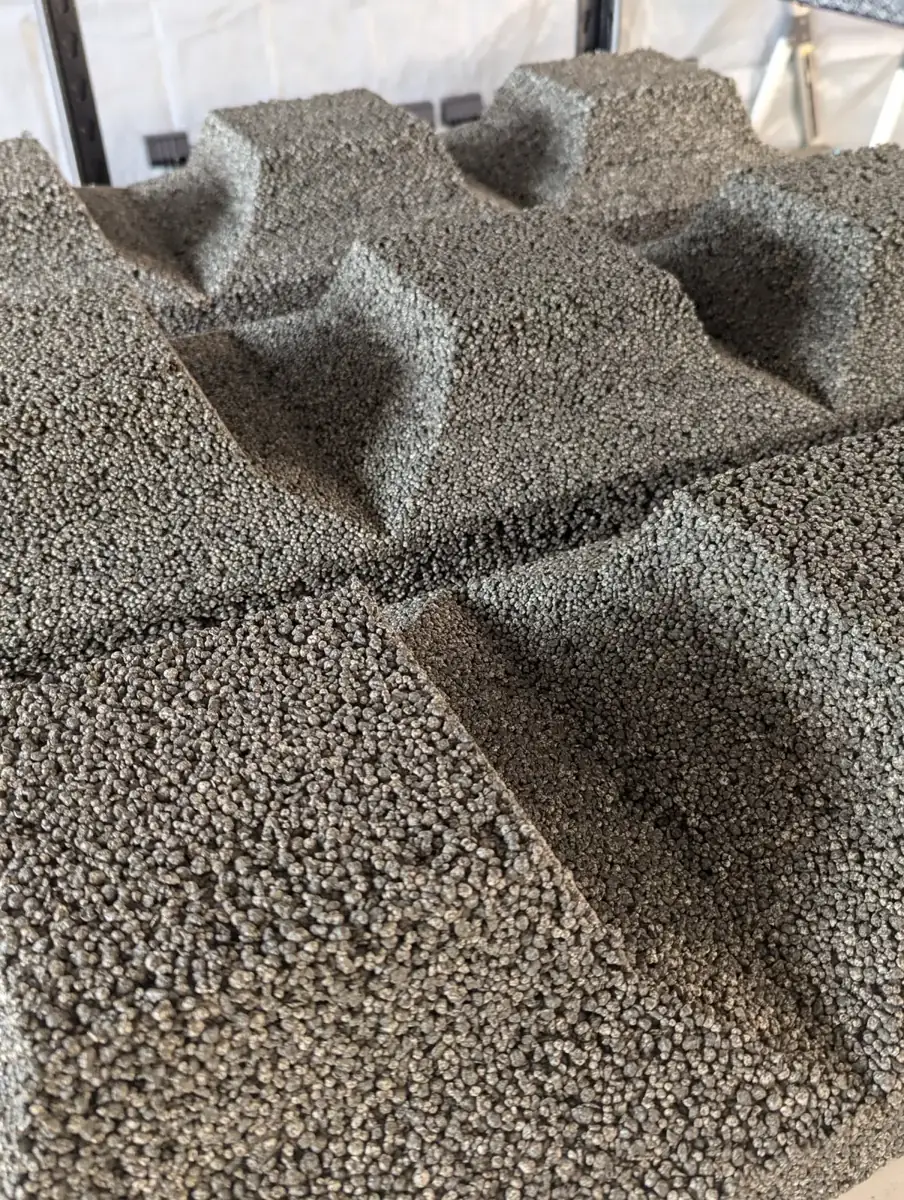 Freshly demolded block halves showing the core shapes