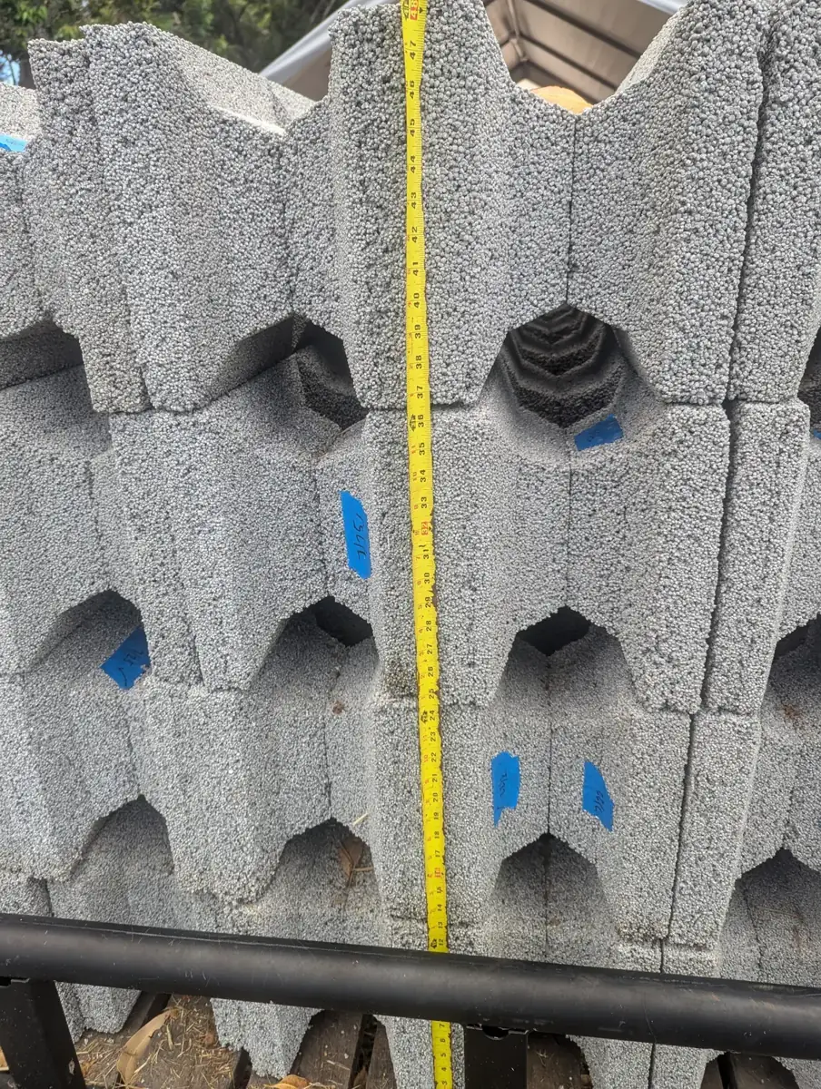 Tape measure checking the height of a stack of blocks